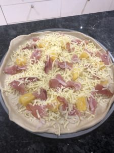 Uncooked Hawaiian pizza